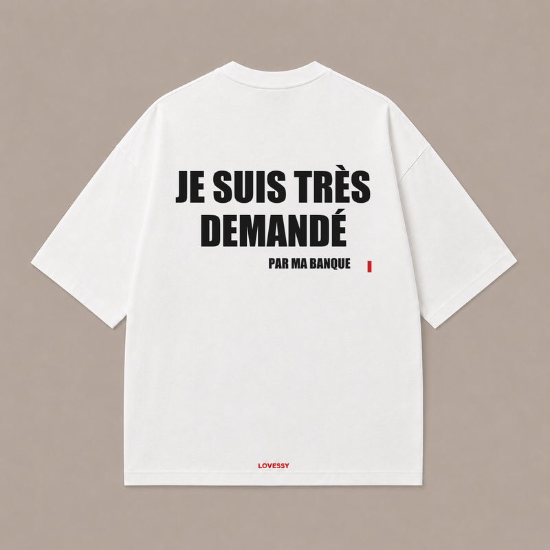 T-shirt blanc LOVESSY — JE SUIS TRÈS DEMANDÉ PAR MA BANQUE